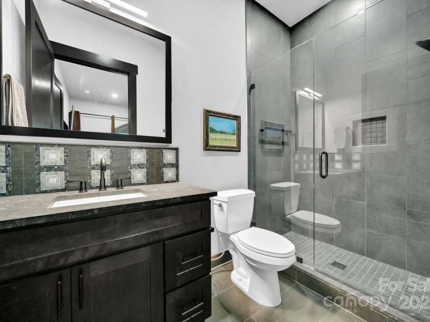 36 Northland Court, Flat Rock, NC 28731.  MLS# CAR4293031, YatesRealty ID 1814. Guest bedroom ensuite bathroom w/ walk in shower