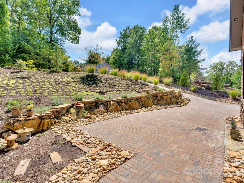 36 Northland Court, Flat Rock, NC 28731.  MLS# CAR4293031, YatesRealty ID 1814. Low maintenance landscaping - front yard