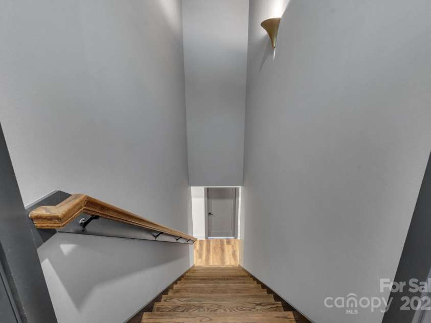 36 Northland Court, Flat Rock, NC 28731.  MLS# CAR4293031, YatesRealty ID 1814. Stairs leading to basement & studio apartment 