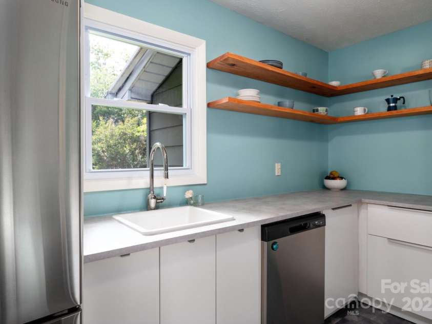 189 Onteora Boulevard, Asheville, NC 28803.  MLS# CAR4266756, YatesRealty ID 18146. Window Overlooks Back Yard