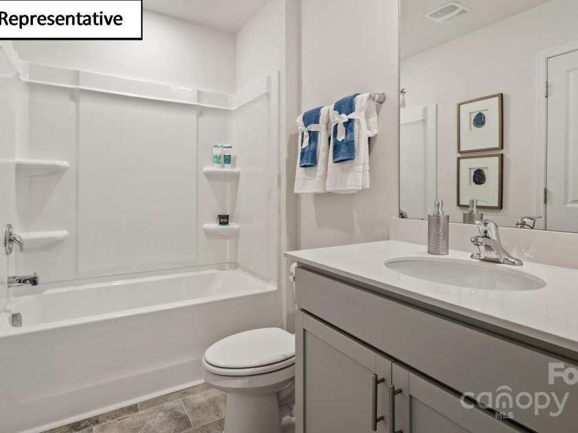 5908 Faron Way, Charlotte, NC 28262.  MLS# CAR4268511, YatesRealty ID 18158. Hall bathroom