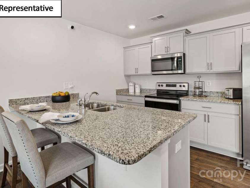 5106 Hyrule Drive, Charlotte, NC 28262.  MLS# CAR4268519, YatesRealty ID 18160. Open kitchen with peninsula