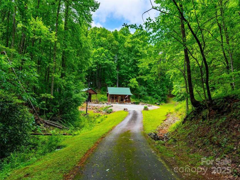 125 Cypress Lane, Saluda, NC 28773.  MLS# CAR4265595, YatesRealty ID 18163. Set back for privacy, peace and quiet.