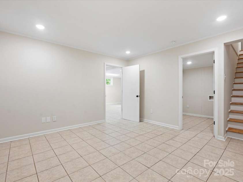 981 Meadowlark Drive, Rock Hill, SC 29732.  MLS# CAR4251814, YatesRealty ID 18166. Basement flex room leading to laundry #2 with chute