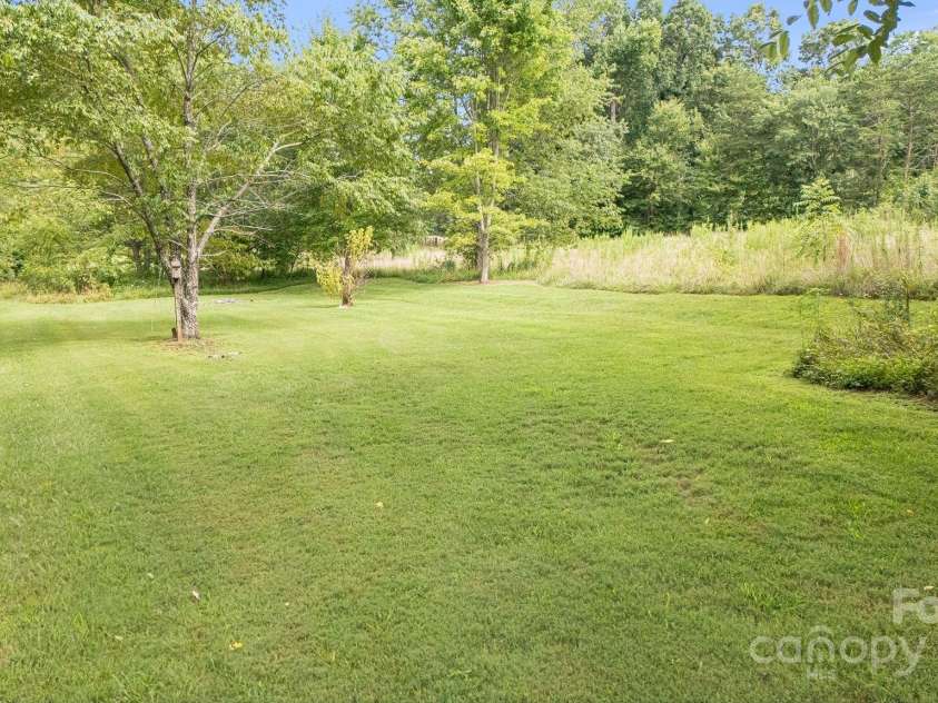 1694 Mud Cut Road, Marion, NC 28752.  MLS# CAR4218182, YatesRealty ID 18169. A portion of the back yard