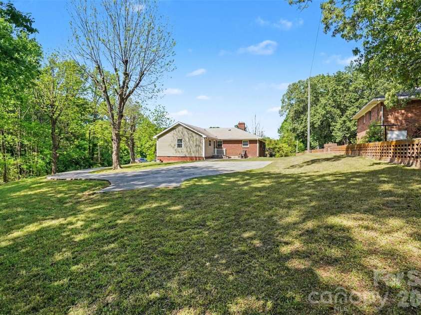 831 Maurice Street, Monroe, NC 28112.  MLS# CAR4370093, YatesRealty ID 18169. Backyard and patio