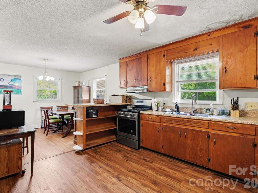 831 Maurice Street, Monroe, NC 28112.  MLS# CAR4370093, YatesRealty ID 18169. Kitchen into dining area
