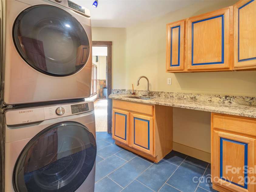 15 Mountain Tea Lane, Alexander, NC 28701.  MLS# CAR4276660, YatesRealty ID 18176. Main Floor Laundry