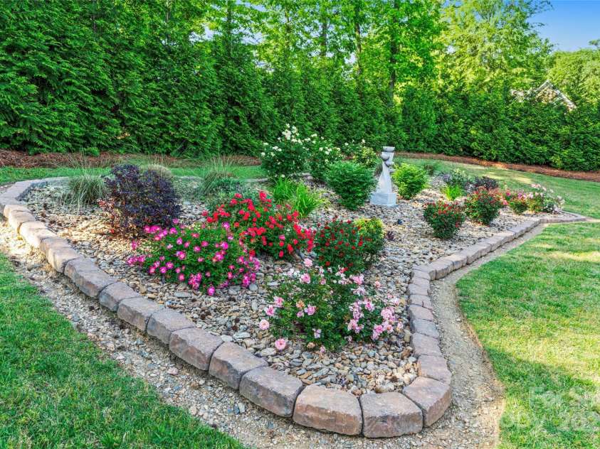 6010 Albiza Drive, Harrisburg, NC 28075.  MLS# CAR4256175, YatesRealty ID 18179. Beautiful Landscaping.