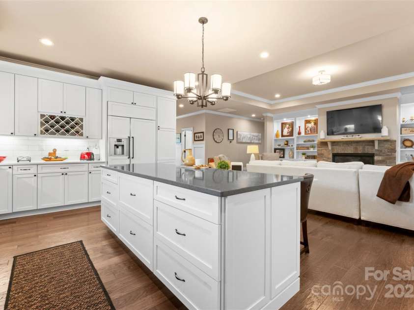 6010 Albiza Drive, Harrisburg, NC 28075.  MLS# CAR4256175, YatesRealty ID 18179. Custom Chef's Kitchen with Built-In Refrigerator.