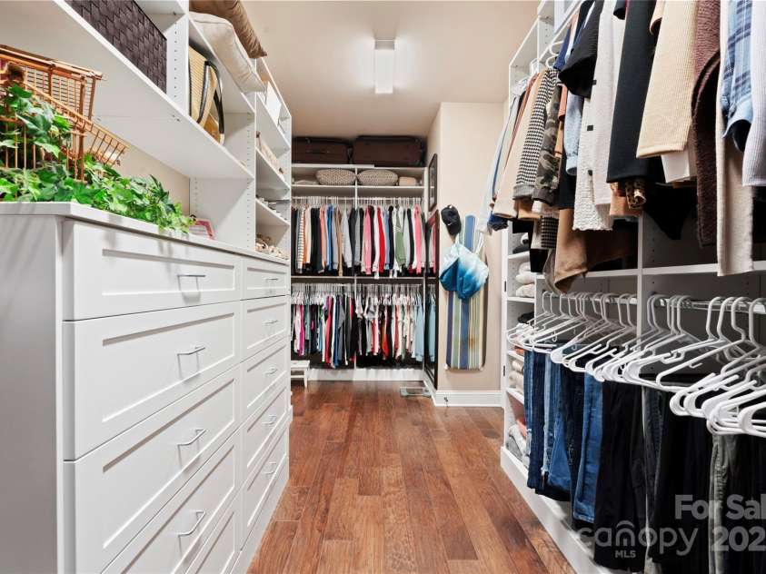 6010 Albiza Drive, Harrisburg, NC 28075.  MLS# CAR4256175, YatesRealty ID 18179. Custom Closet with Dresser, Valet Bars, and Shoe Storage.
