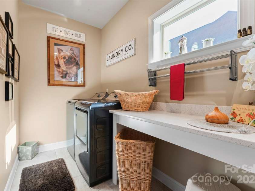 6010 Albiza Drive, Harrisburg, NC 28075.  MLS# CAR4256175, YatesRealty ID 18179. Laundry Room Accessible Through Primary Closet and Hallway.