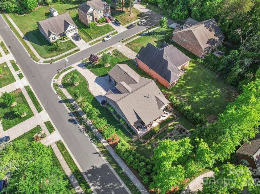 6010 Albiza Drive, Harrisburg, NC 28075.  MLS# CAR4256175, YatesRealty ID 18179. Mature Landscaping Creates Total Privacy.