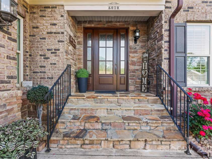6010 Albiza Drive, Harrisburg, NC 28075.  MLS# CAR4256175, YatesRealty ID 18179. Oversized Front Entry Porch.