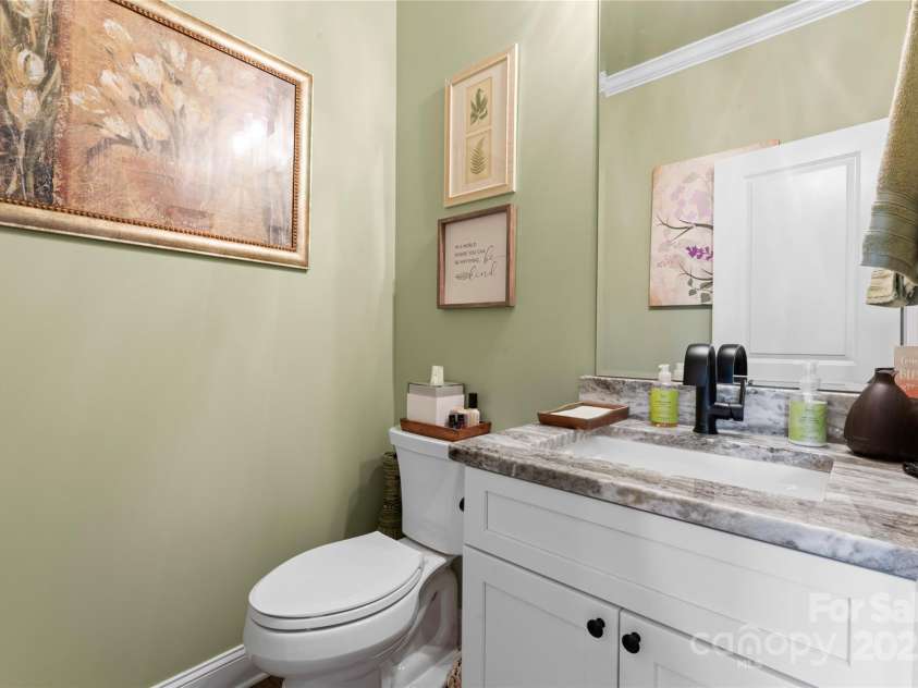 6010 Albiza Drive, Harrisburg, NC 28075.  MLS# CAR4256175, YatesRealty ID 18179. Upgraded Half Bath.
