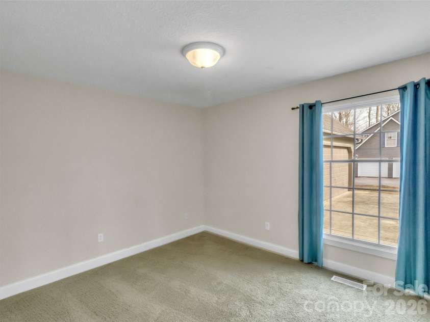 303 Forest Place, Candler, NC 28715.  MLS# CAR4342889, YatesRealty ID 18190. 