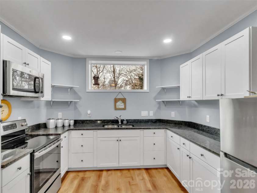 303 Forest Place, Candler, NC 28715.  MLS# CAR4342889, YatesRealty ID 18190. 