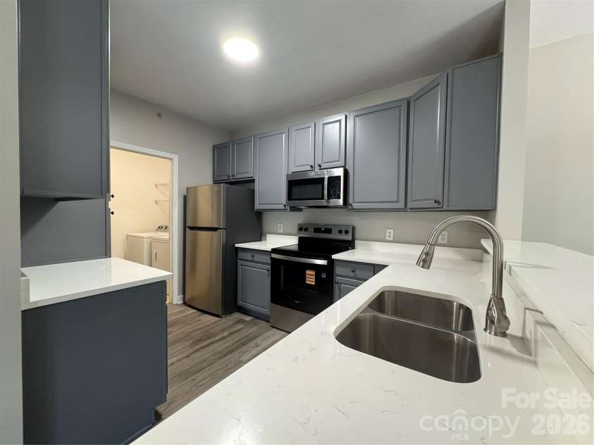 10676 Hill Point Court, Charlotte, NC 28262.  MLS# CAR4388592, YatesRealty ID 18194. Alternate view of kitchen
