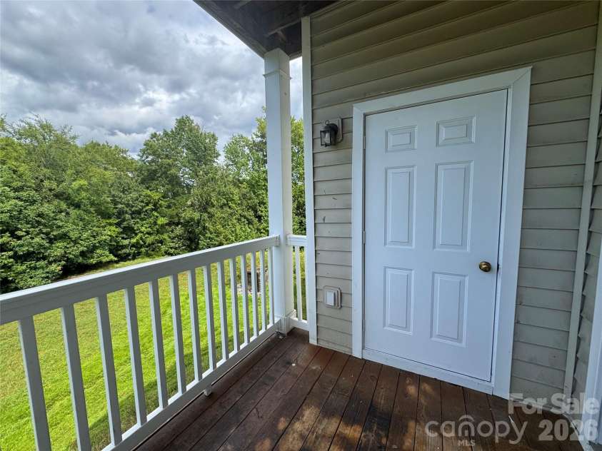 10676 Hill Point Court, Charlotte, NC 28262.  MLS# CAR4388592, YatesRealty ID 18194. Balcony View of Woods & Storage