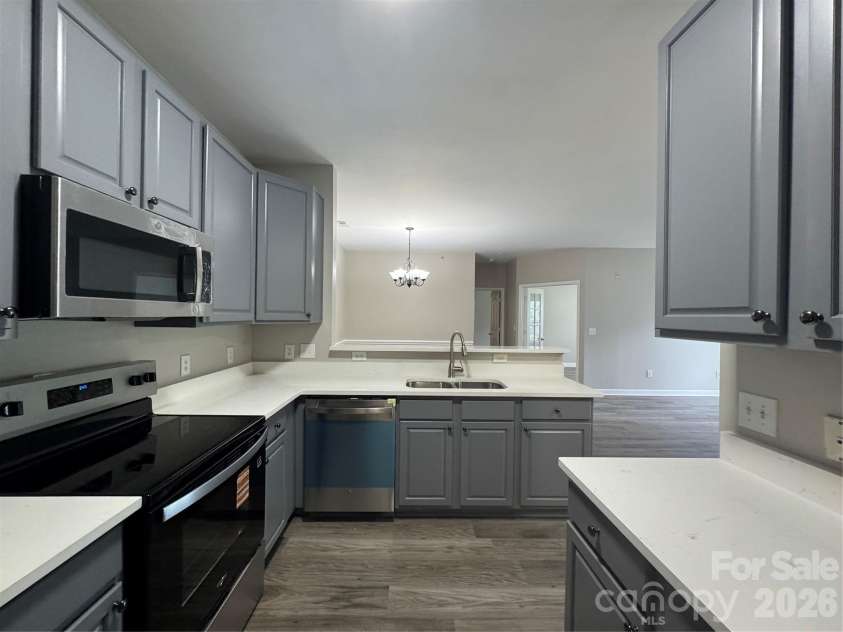 10676 Hill Point Court, Charlotte, NC 28262.  MLS# CAR4388592, YatesRealty ID 18194. Kitchen view from Refrigerator / Pantry