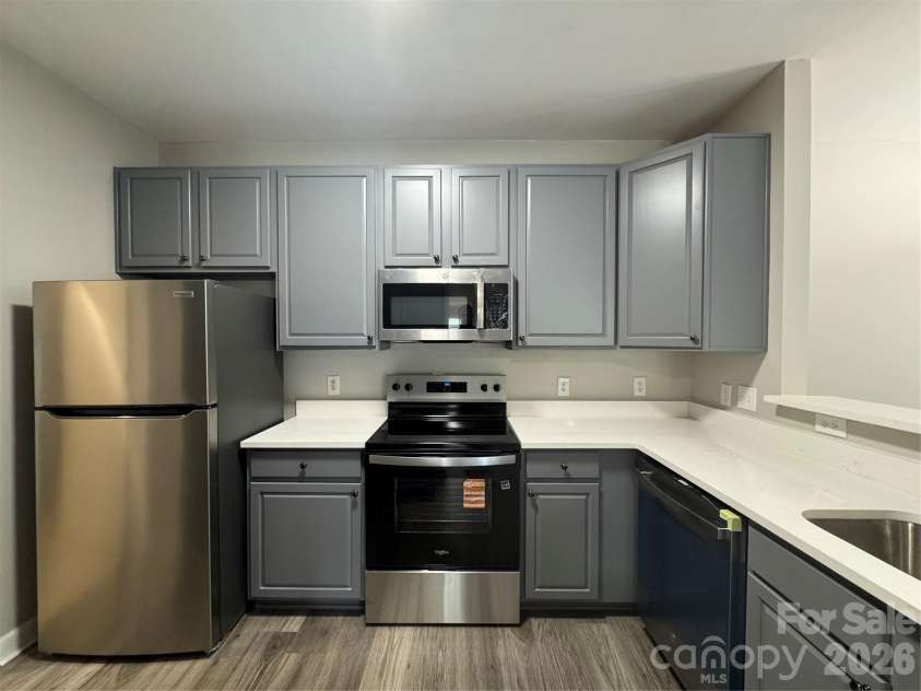 10676 Hill Point Court, Charlotte, NC 28262.  MLS# CAR4388592, YatesRealty ID 18194. View looking into Kitchen. Freshly painted cabinets and new range