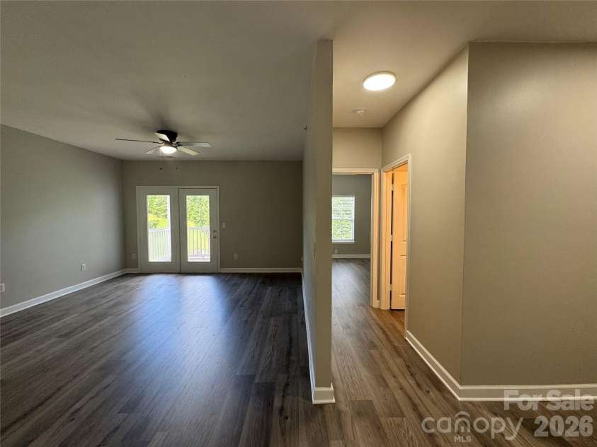 10676 Hill Point Court, Charlotte, NC 28262.  MLS# CAR4388592, YatesRealty ID 18194. View of Living Room & Entry to Bedroom 2 & Bathroom 2