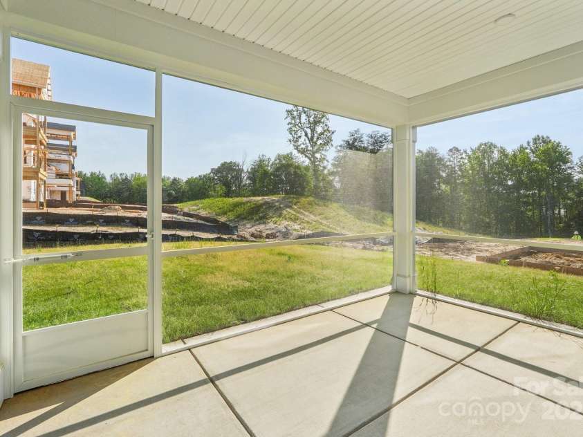 220 Windy Dell Drive, Tega Cay, SC 29708.  MLS# CAR4266344, YatesRealty ID 18198. Covered patio