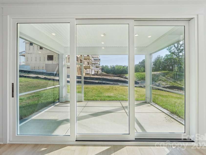 220 Windy Dell Drive, Tega Cay, SC 29708.  MLS# CAR4266344, YatesRealty ID 18198. Sliding Glass door to Covered Patio