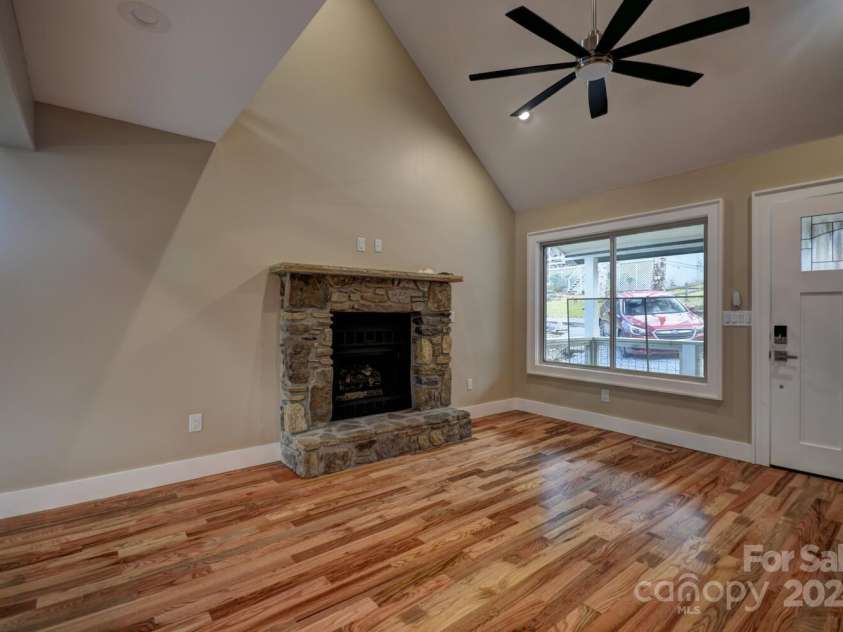 20 Lisa Lane, Maggie Valley, NC 28751.  MLS# CAR4126397, YatesRealty ID 182. Great Room/Fireplace