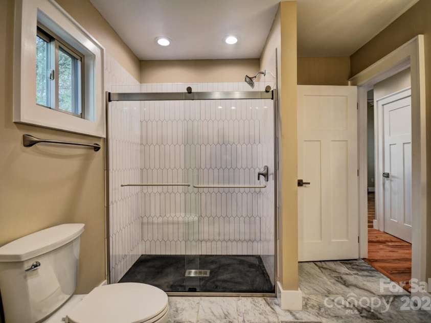20 Lisa Lane, Maggie Valley, NC 28751.  MLS# CAR4126397, YatesRealty ID 182. Master Bath - Walk-in Shower - Kohler Fixtures and Shower Door