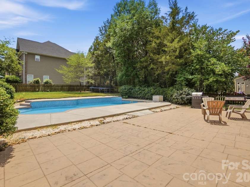 5008 Rosewater Lane, Indian Trail, NC 28079.  MLS# CAR4335449, YatesRealty ID 18201. Huge Patio & Pool Deck