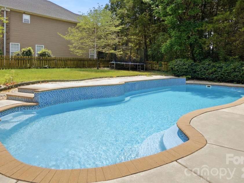 5008 Rosewater Lane, Indian Trail, NC 28079.  MLS# CAR4335449, YatesRealty ID 18201. In-ground Pool