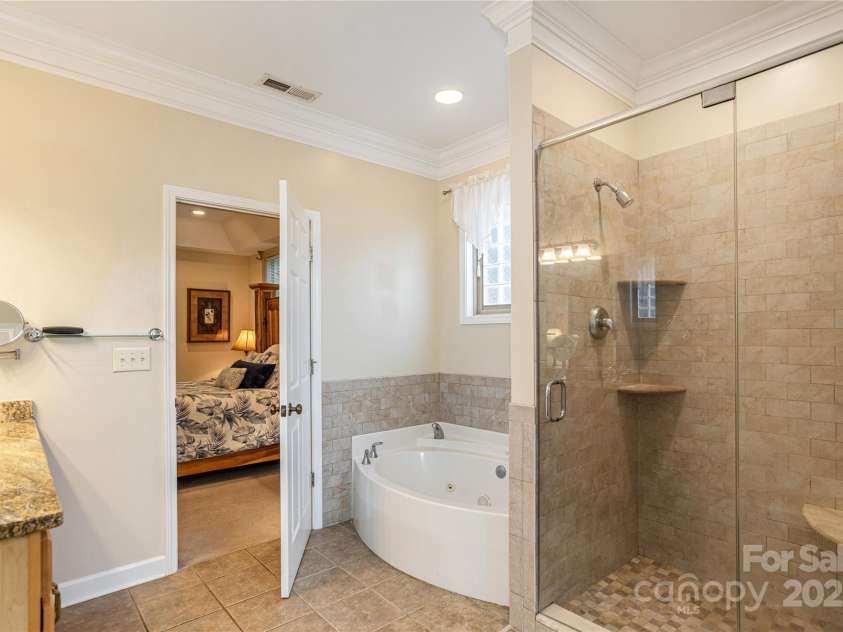 219 Rivercrest Boulevard, Arden, NC 28704.  MLS# CAR4124983, YatesRealty ID 1821. Soaking Jet Tub and Large Walk-In Shower