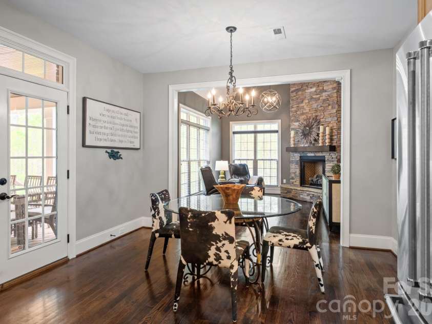 3143 James Plantation Drive, Denver, NC 28037.  MLS# CAR4366315, YatesRealty ID 18210. Bright dining area with direct access to the covered porch, creating effortless indoor-outdoor living.