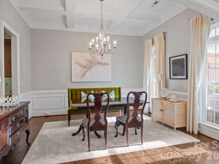3143 James Plantation Drive, Denver, NC 28037.  MLS# CAR4366315, YatesRealty ID 18210. Formal dining room featuring coffered ceiling, wainscoting, and abundant natural light.