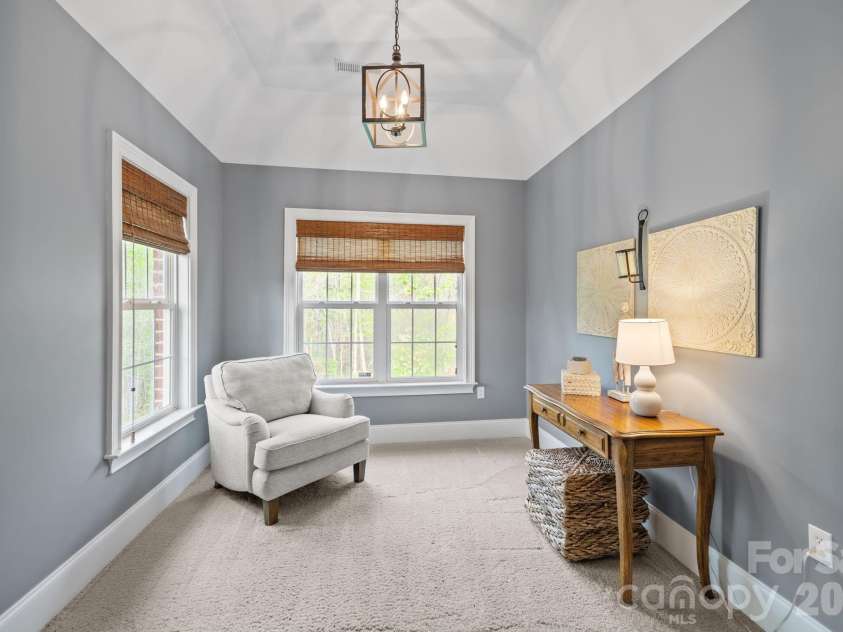 3143 James Plantation Drive, Denver, NC 28037.  MLS# CAR4366315, YatesRealty ID 18210. Private sitting room or home office with vaulted ceiling and large windows, offering a quiet and flexible space just off the primary suite.