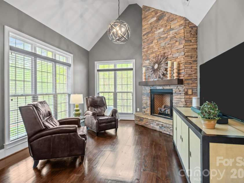 3143 James Plantation Drive, Denver, NC 28037.  MLS# CAR4366315, YatesRealty ID 18210. Secondary living space/den with vaulted ceiling and stone fireplace for added flexibility.