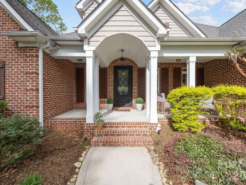 3143 James Plantation Drive, Denver, NC 28037.  MLS# CAR4366315, YatesRealty ID 18210. Welcoming front elevation with classic architectural details and timeless curb appeal.