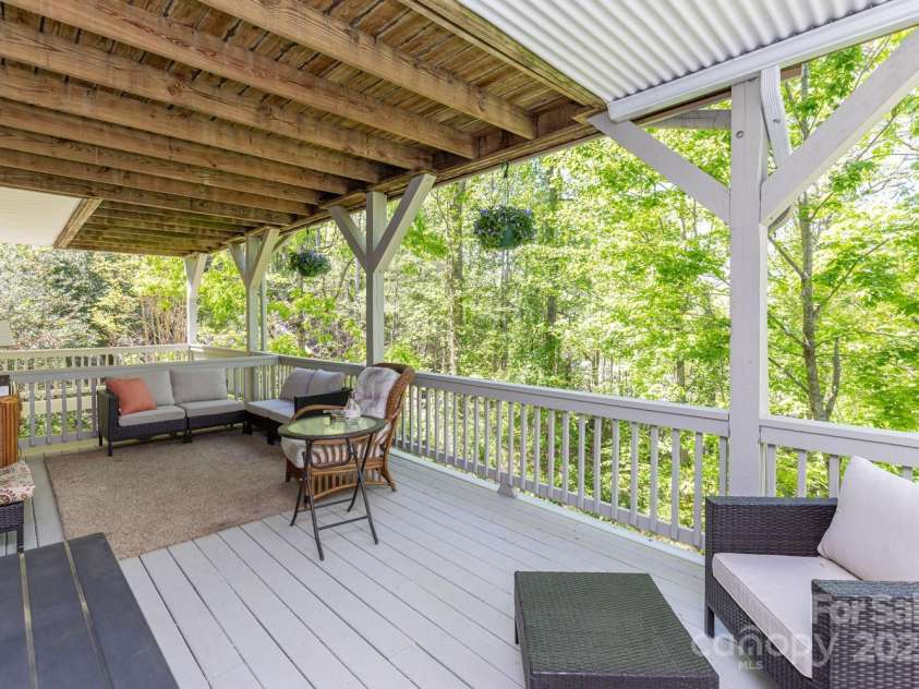 127 Poppy Lane, Asheville, NC 28803.  MLS# CAR4252357, YatesRealty ID 18218. Downstairs - Covered Deck