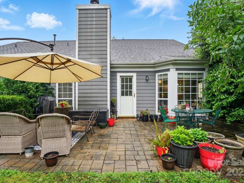 6717 Bickham Lane, Charlotte, NC 28269.  MLS# CAR4257776, YatesRealty ID 18226. Back patio