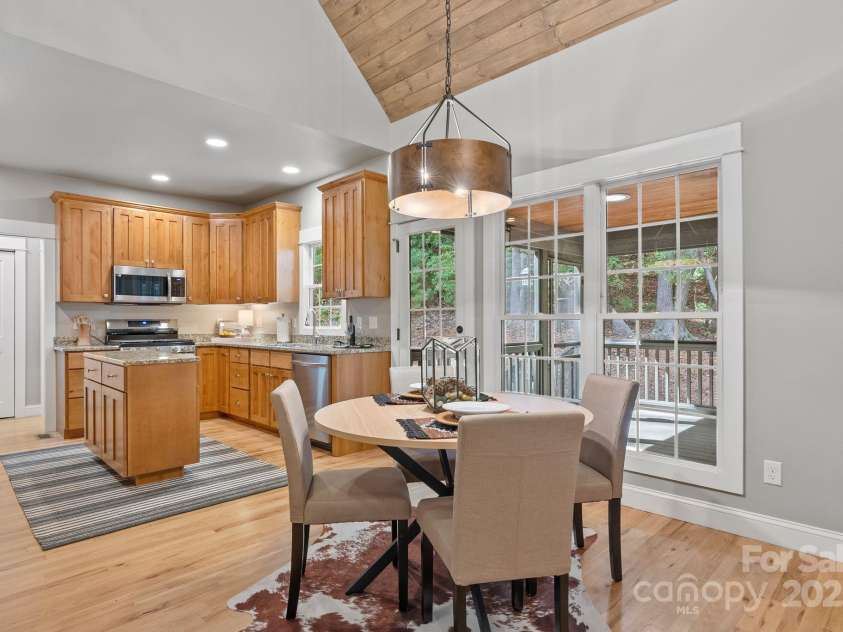 605 Salola Lane, Brevard, NC 28712.  MLS# CAR4312088, YatesRealty ID 18227. Breakfast nook between the living room & kitchen