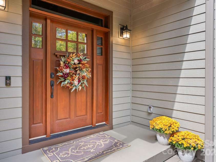 605 Salola Lane, Brevard, NC 28712.  MLS# CAR4312088, YatesRealty ID 18227. Cozy covered porch