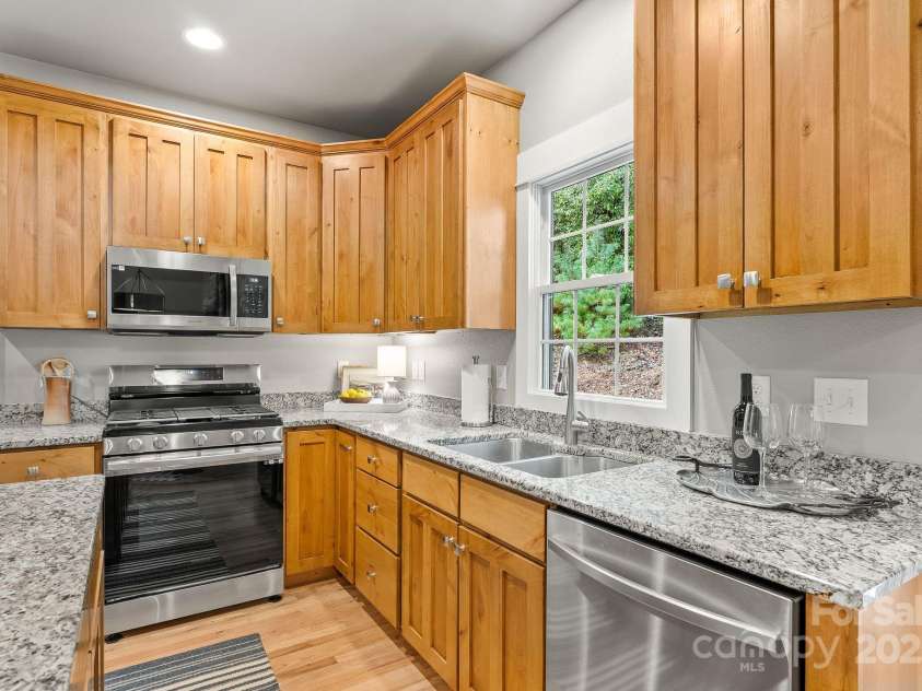 605 Salola Lane, Brevard, NC 28712.  MLS# CAR4312088, YatesRealty ID 18227. Gas stove & recessed lighting