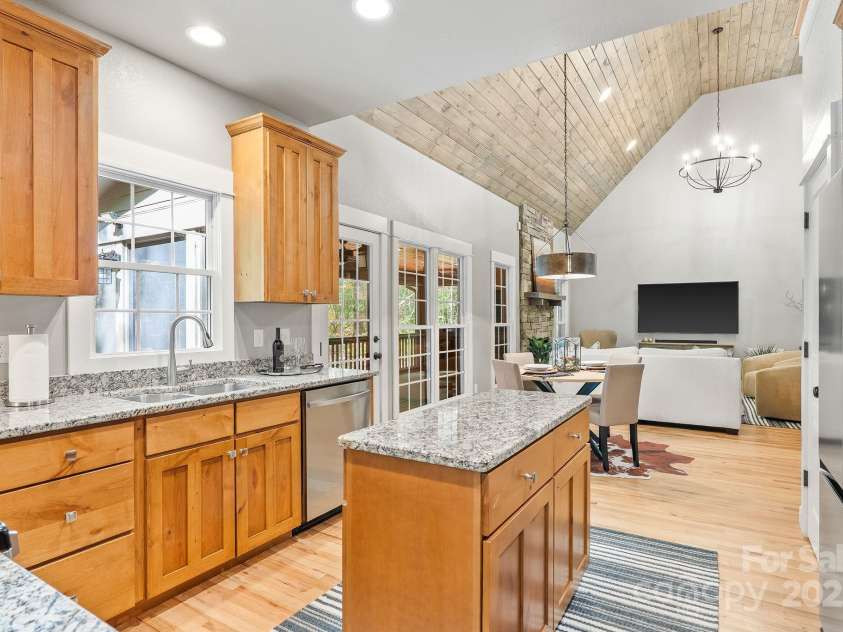 605 Salola Lane, Brevard, NC 28712.  MLS# CAR4312088, YatesRealty ID 18227. Prep island, granite countertops & all wood, shaker style cabinetry