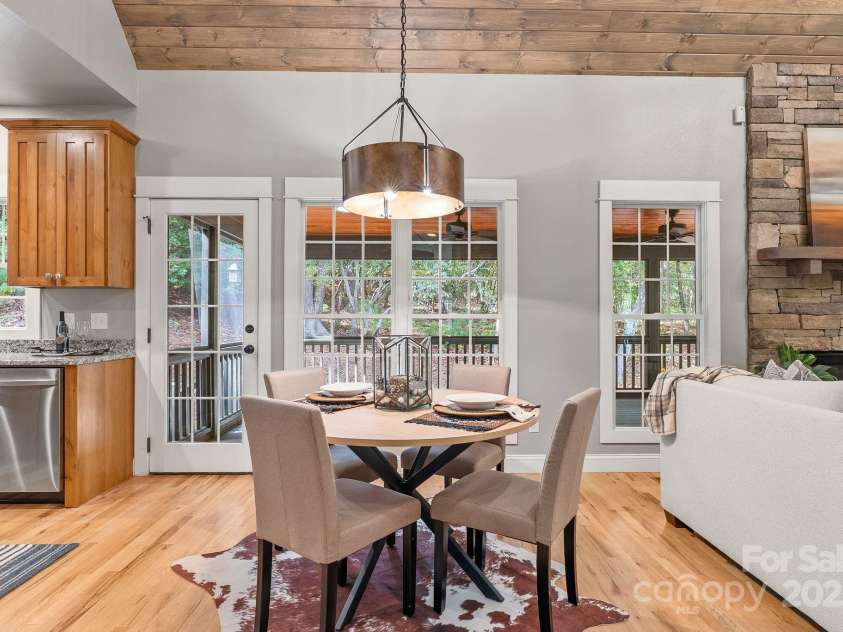 605 Salola Lane, Brevard, NC 28712.  MLS# CAR4312088, YatesRealty ID 18227. Windows & door to the screened porch facing the private back of the lot