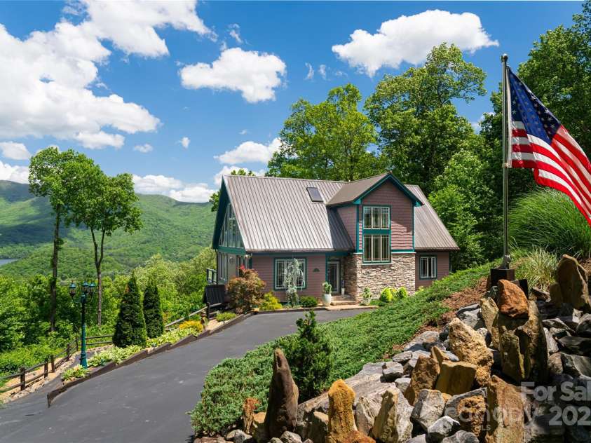 1 Wood Haven Lane, Black Mountain, NC 28711.  MLS# CAR4222686, YatesRealty ID 1823. Front overview of the home with bold lake views 