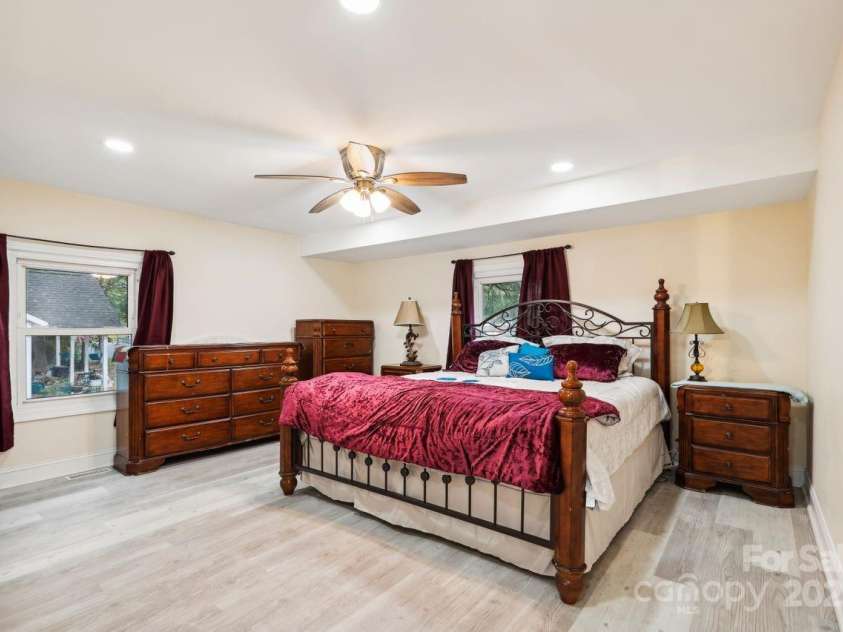 712 Grace Avenue, Kannapolis, NC 28083.  MLS# CAR4252266, YatesRealty ID 18233. Oversized primary suite offers a private retreat with a spa-like bath, including a glass-enclosed shower and an expansive walk-in closet.