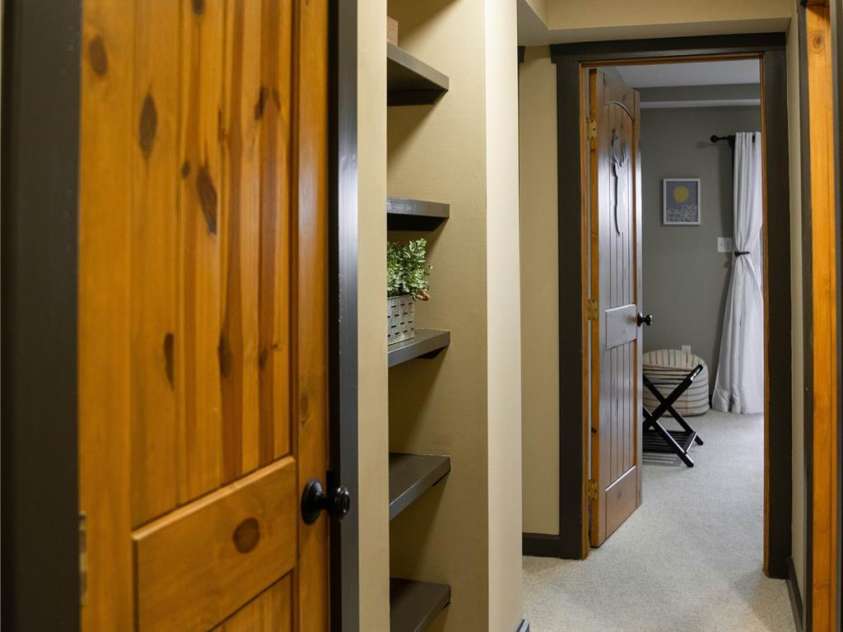 425 Flat Top Mountain Road, Fairview, NC 28730.  MLS# CAR4343659, YatesRealty ID 1824. Lower Level Hallway