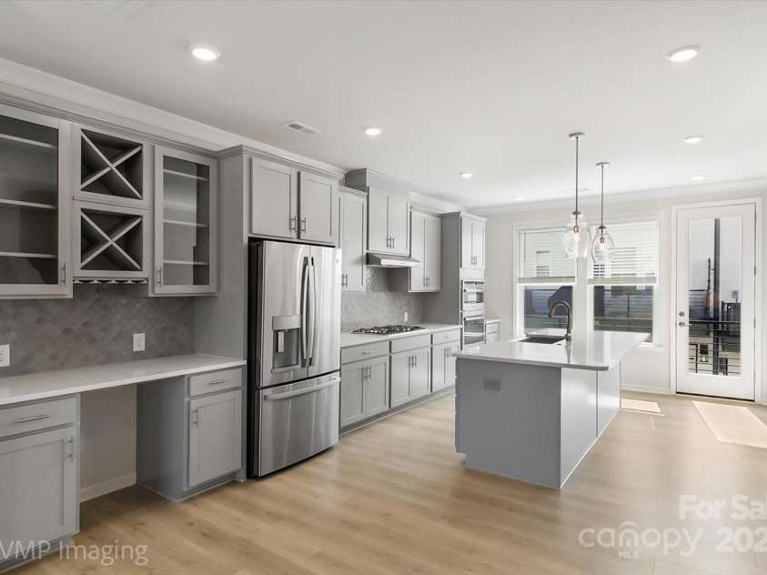 6027 Towering Oaks Drive, Charlotte, NC 28205.  MLS# CAR4298053, YatesRealty ID 18240. Kitchen with view to terrace