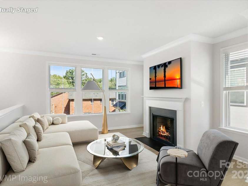 6027 Towering Oaks Drive, Charlotte, NC 28205.  MLS# CAR4298053, YatesRealty ID 18240. Main level great room (virtually staged)